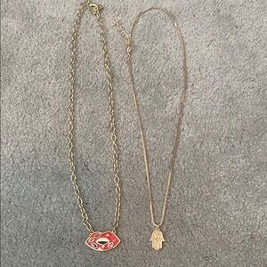 Set of two adjustable gold tone necklaces.
